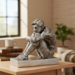 13-Inch Seated Male Figure Sculpture