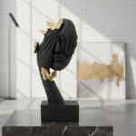 Face in Hands Sculpture with Golden Butterfly
